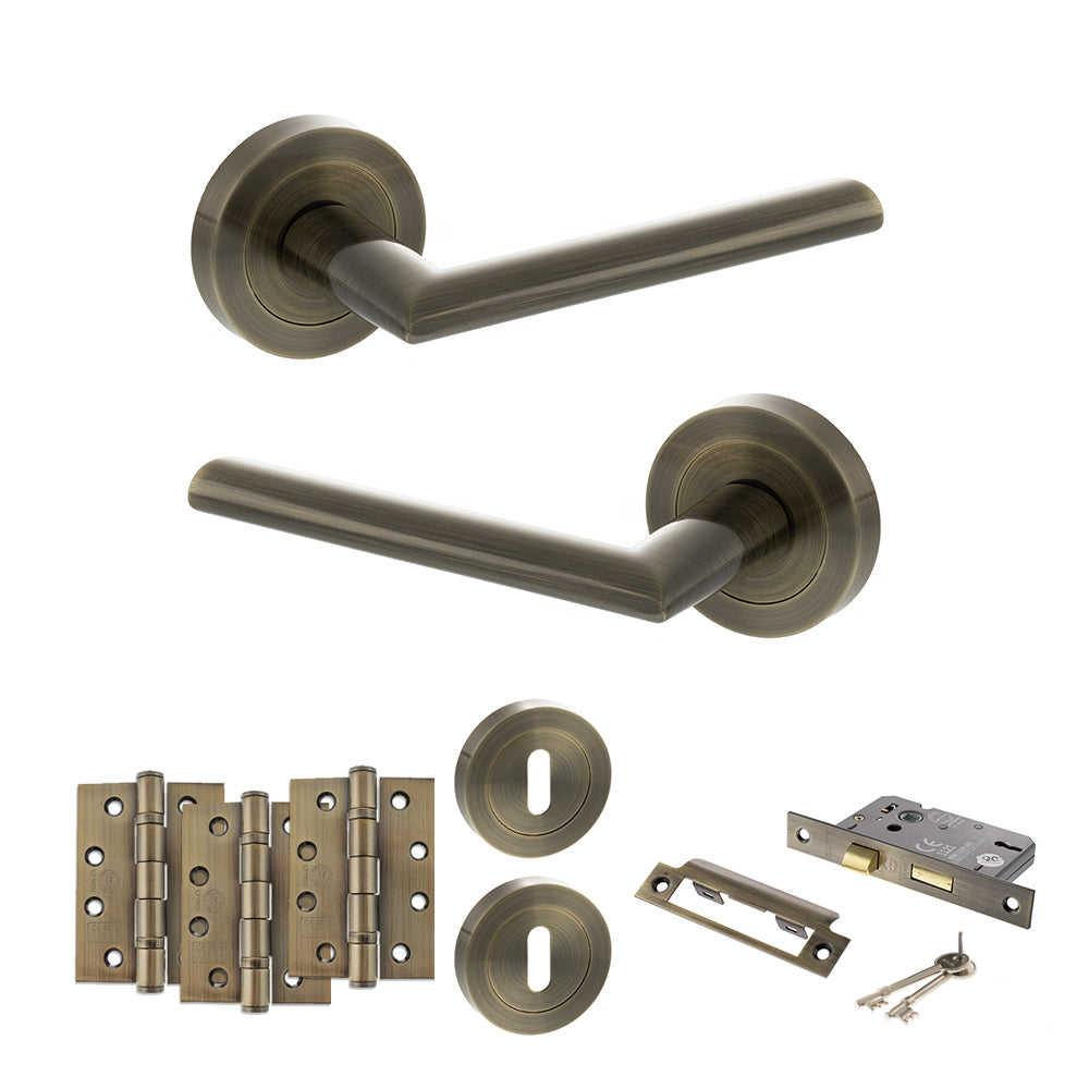 Quality image of STATUS Alabama Door Handle Pack (3 Lever Lock Set - 2.5" CE Sashlock, 4" Fire Rated Hinges x3) - Antique Brass | Sku. adps43rab16 | available from Trade Door Handles.