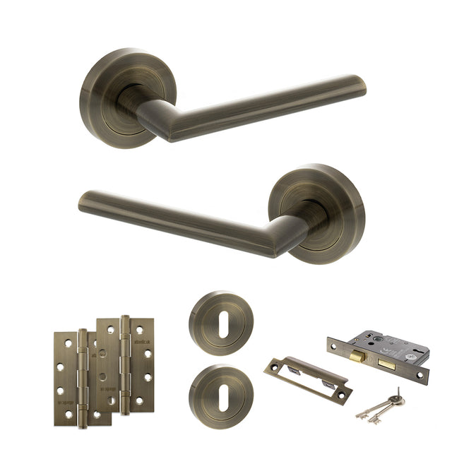 Quality image of STATUS Alabama Door Handle Pack (3 Lever Lock Set - 2.5" CE Sashlock, 4" Slim Knuckle Hinges x2) - Antique Brass | Sku. adps43rab18 | available from Trade Door Handles.