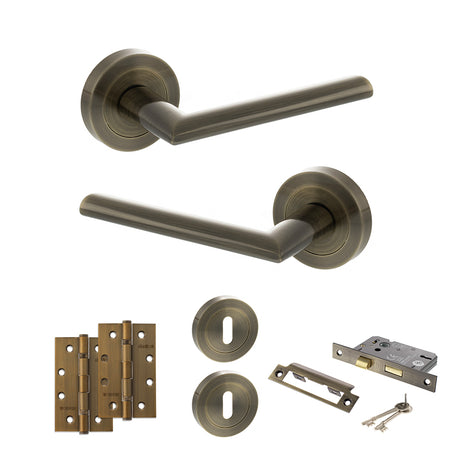 Quality image of STATUS Alabama Door Handle Pack (3 Lever Lock Set - 3" CE Sashlock, 4" Slim Knuckle Hinges x2) - Antique Brass | Sku. adps43rab19 | available from Trade Door Handles.