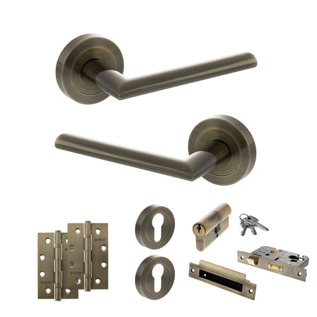 Quality image of STATUS Alabama Door Handle Pack (Euro Lock Set - 2.5" CE Sashlock, 4" Slim Knuckle Hinges x2) - Antique Brass | Sku. adps43rab24 | available from Trade Door Handles.