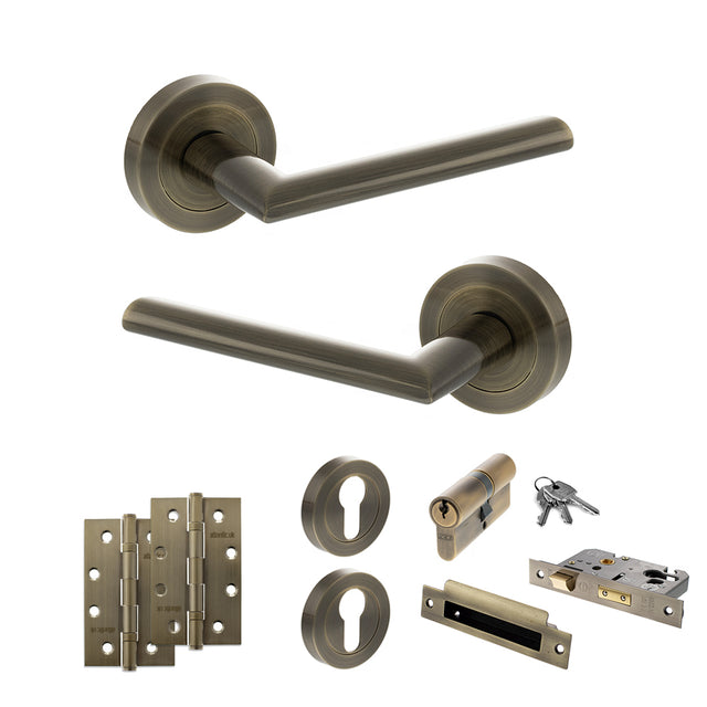 Quality image of STATUS Alabama Door Handle Pack (Euro Lock Set - 3" CE Sashlock, 4" Slim Knuckle Hinges x2) - Antique Brass | Sku. adps43rab25 | available from Trade Door Handles.