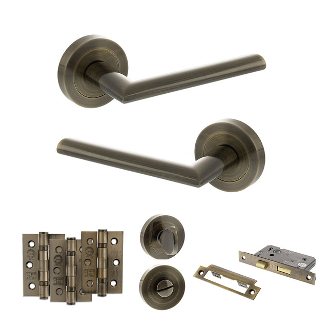 Quality image of STATUS Alabama Door Handle Pack (Bathroom Set - 3" CE Bathroom Lock, 3" Fire Rated Hinges x3) - Antique Brass | Sku. adps43rab9 | available from Trade Door Handles.
