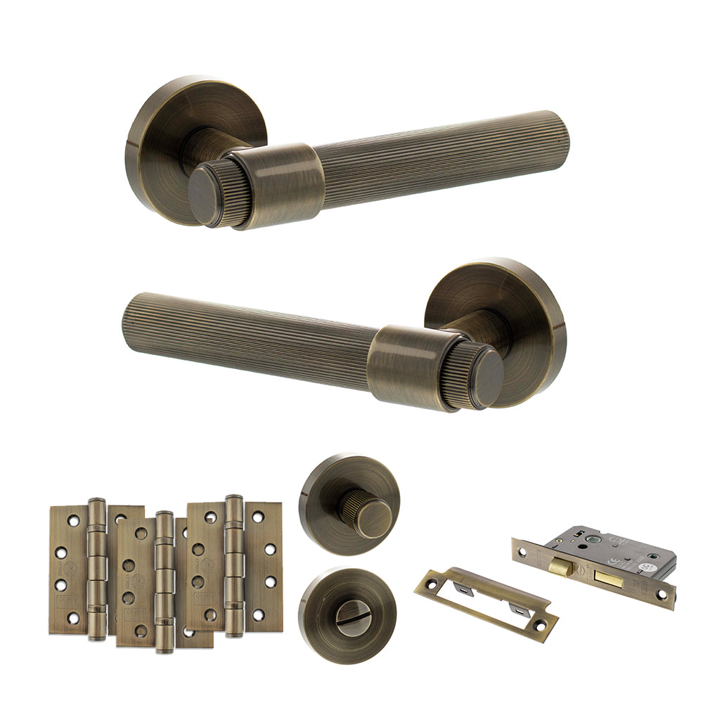 Quality image of Senza Pari Fasana Door Handle Pack (Bathroom Set - 2.5" CE Bathroom Lock, 4" Fire Rated Hinges x3) - Antique Brass | Sku. adpspr165ab10 | available from Trade Door Handles.