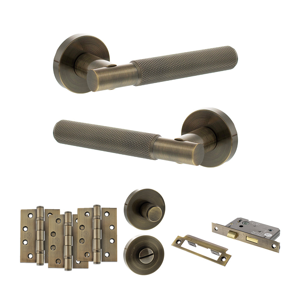 Quality image of Senza Pari Rosarno Door Handle Pack (Bathroom Set - 2.5" CE Bathroom Lock, 4" Fire Rated Hinges x3) - Antique Brass | Sku. adpspr170ab10 | available from Trade Door Handles.