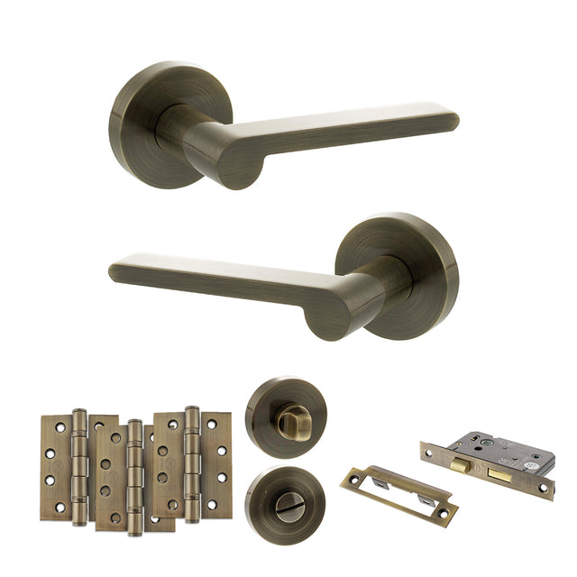 Quality image of Senza Pari Darrio Door Handle Pack (Bathroom Set - 2.5" CE Bathroom Lock, 4" Fire Rated Hinges x3) - Antique Brass | Sku. adpspro218ab10 | available from Trade Door Handles.