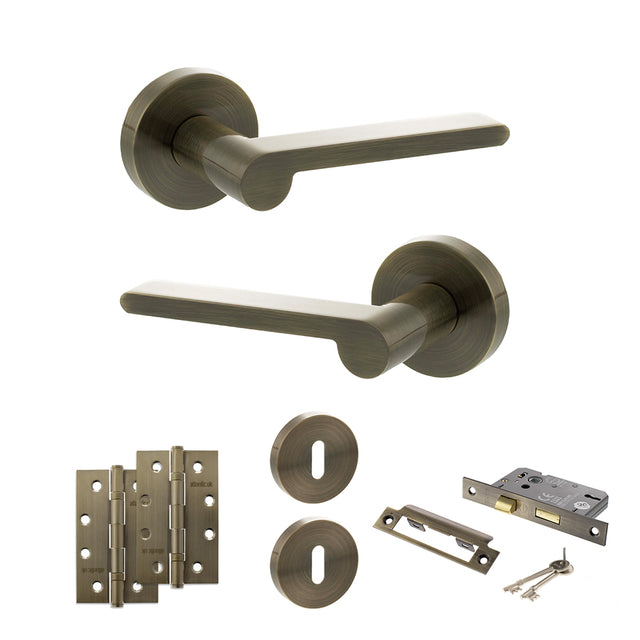 Quality image of Senza Pari Darrio Door Handle Pack (3 Lever Lock Set - 2.5" CE Sashlock, 4" Slim Knuckle Hinges x2) - Antique Brass | Sku. adpspro218ab18 | available from Trade Door Handles.