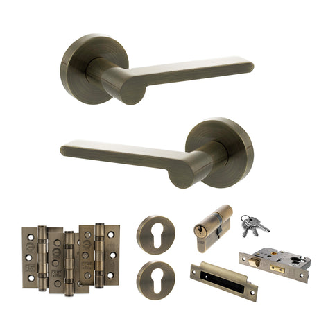 Quality image of Senza Pari Darrio Door Handle Pack (Euro Lock Set - 3" CE Sashlock, 3" Fire Rated Hinges x3) - Antique Brass | Sku. adpspro218ab21 | available from Trade Door Handles.