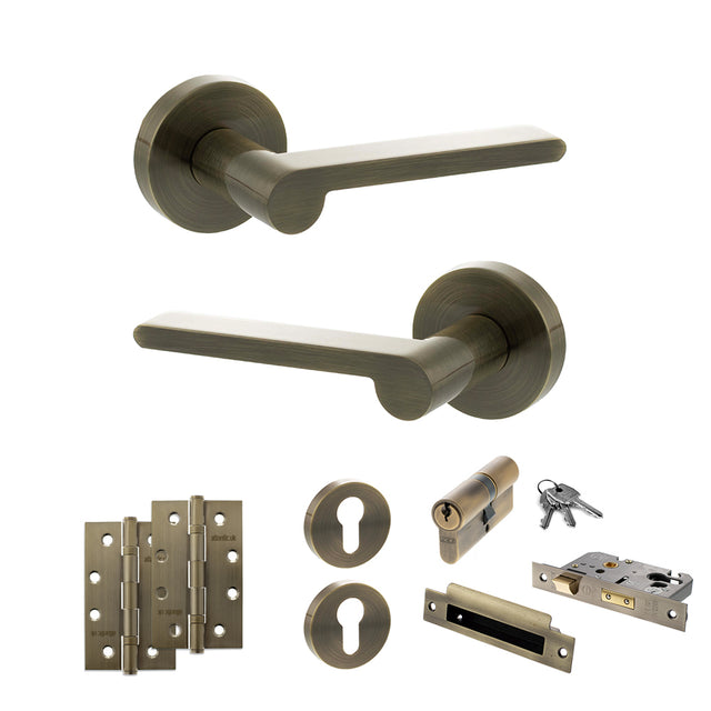 Quality image of Senza Pari Darrio Door Handle Pack (Euro Lock Set - 3" CE Sashlock, 4" Slim Knuckle Hinges x2) - Antique Brass | Sku. adpspro218ab25 | available from Trade Door Handles.