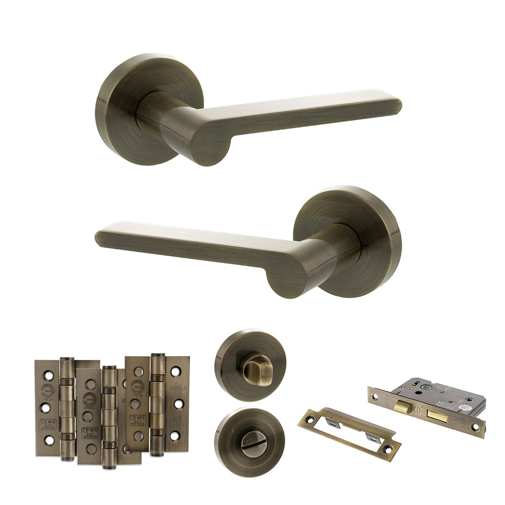 Quality image of Senza Pari Darrio Door Handle Pack (Bathroom Set - 3" CE Bathroom Lock, 3" Fire Rated Hinges x3) - Antique Brass | Sku. adpspro218ab9 | available from Trade Door Handles.