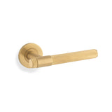 High quality image of Alexander & Wilks - Knurled Kingstone Lever on Round Rose - Satin Brass PVD | Sku. aw240sbpvd | Trade Door Handles.
