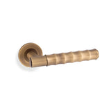 High quality image of Alexander & Wilks - Spitfire Bamboo Lever on Rose - Antique Brass | Sku. aw225ab | Trade Door Handles.