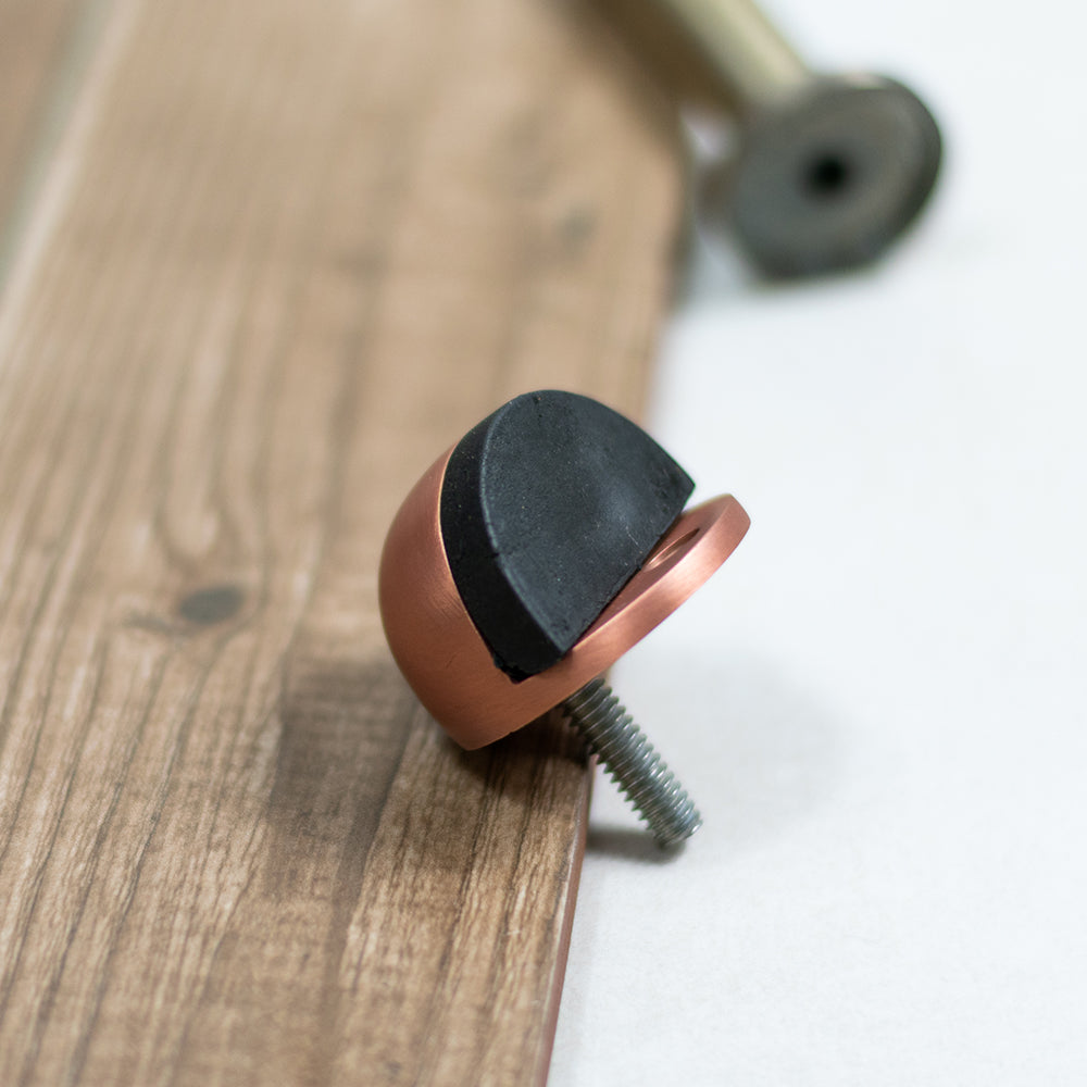Quality image of Atlantic Half-Moon Premium Floor Mounted Door Stop - Antique Copper | Sku. adshmpac | available from Trade Door Handles.