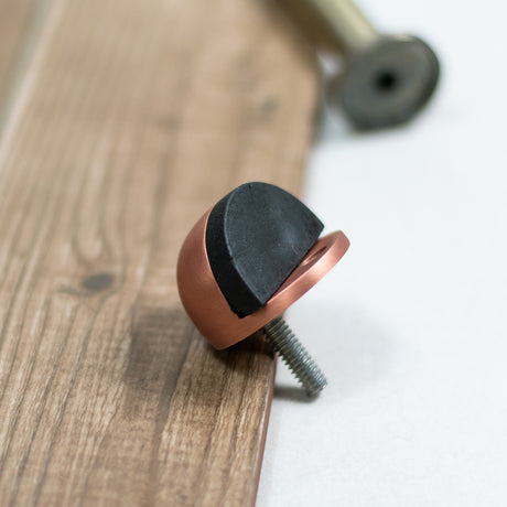 Quality image of Atlantic Half-Moon Premium Floor Mounted Door Stop - Antique Copper | Sku. adshmpac | available from Trade Door Handles.