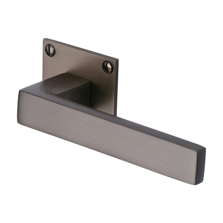 High quality image of the Heritage Brass Door Handle Lever Latch on Square Rose Delta BH Design Matt Bronze Finish | Sku. bau1928-mb | Discounted prices available from Trade Door Handles