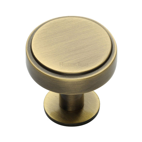 High quality image of the Heritage Brass Cabinet Knob Stepped Disc Design with Rose 38mm Antique Brass Finish | Sku. c3954-38-at | Discounted prices available from Trade Door Handles