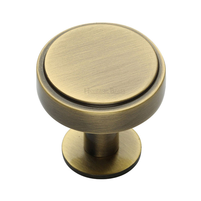 High quality image of the Heritage Brass Cabinet Knob Stepped Disc Design with Rose 38mm Antique Brass Finish | Sku. c3954-38-at | Discounted prices available from Trade Door Handles