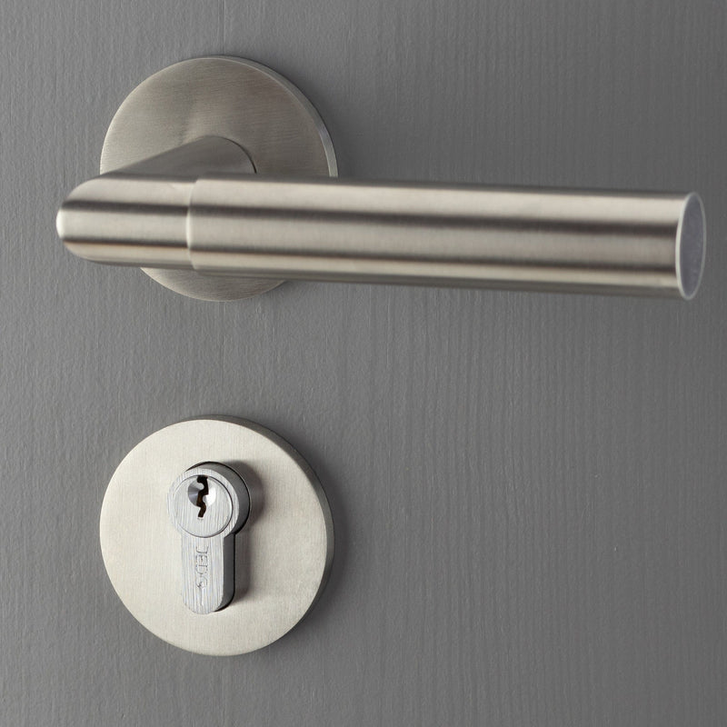 This is an image showing a set of the CRES CR-S10SSS door handles on a round rose