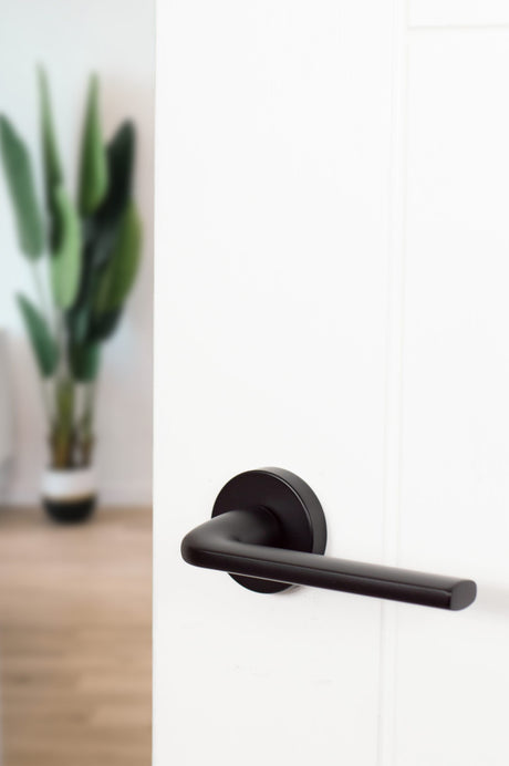 Quality image of CleanTouch Anti-Bac Forme Asti Lever Door Handle on Minimal Round Rose - Matt Black | Sku. ctfmr254mb | available from Trade Door Handles.