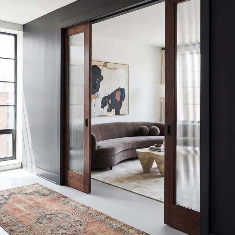 Double pocket doors meeting in the middle of a wide opening
