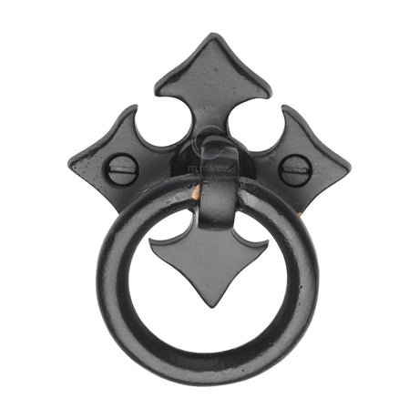 High quality image of the M.Marcus Fleur-De-Lys Cabinet Ring Drop Pull Matt Black Rustic Iron | Sku. fb6331 | Discounted prices available from Trade Door Handles