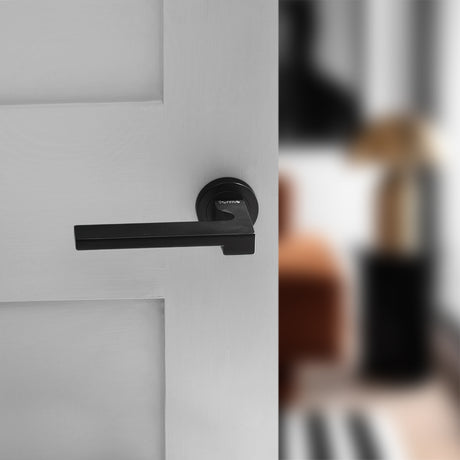 Quality image of Forme Ginevra Lever Door Handle on Minimal Round Rose - Matt Black | Sku. fmr430mb | available from Trade Door Handles.