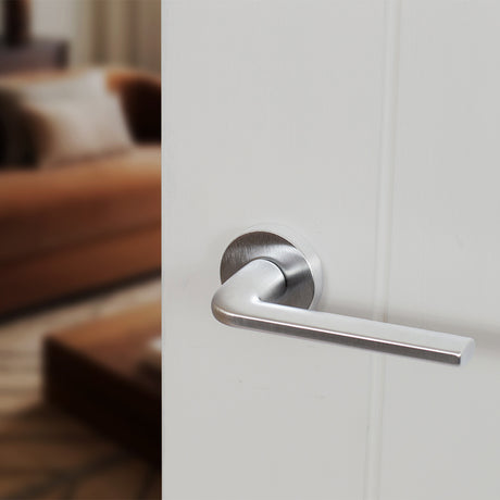 Quality image of Forme Milly Lever Door Handle on Minimal Round Rose - Satin Chrome | Sku. fmr133sc | available from Trade Door Handles.