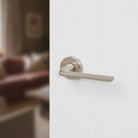 Quality image of Forme Milly Lever Door Handle on Minimal Round Rose - Satin Nickel | Sku. fmr133sn | available from Trade Door Handles.