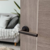 Quality image of Forme Elle Lever Door Handle on Minimal Round Rose - Urban Dark Bronze | Sku. fmr236udb | available from Trade Door Handles.