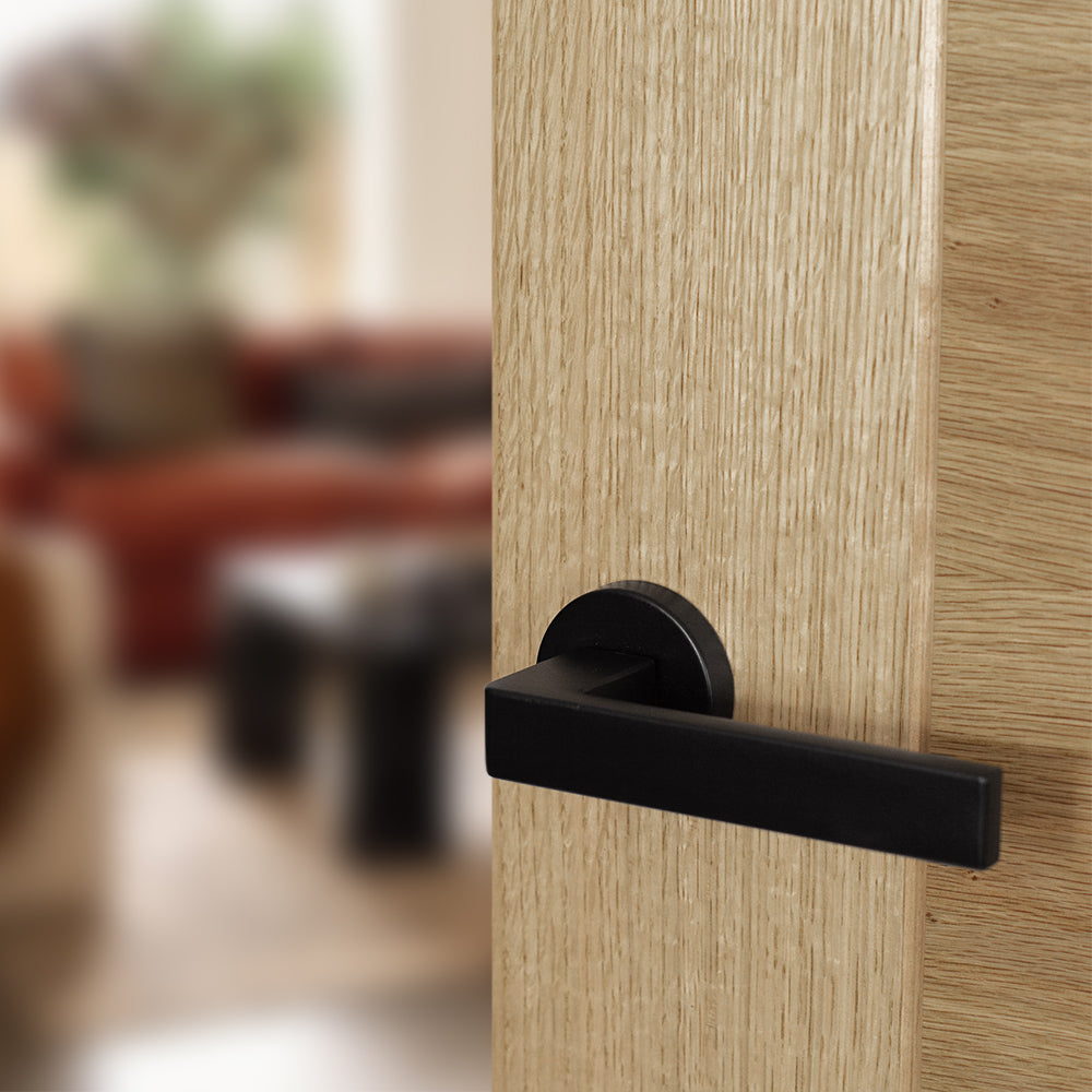Quality image of Forme Asti Lever Door Handle on Minimal Round Rose - Matt Black | Sku. fmr254mb | available from Trade Door Handles.