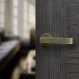 Quality image of Forme Asti Lever Door Handle on Minimal Round Rose - Yester Bronze | Sku. fmr254yb | available from Trade Door Handles.