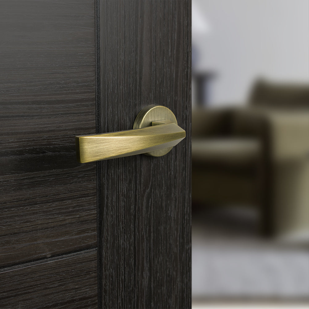 Quality image of Forme Crystal Lever Door Handle on Minimal Round Rose - Yester Bronze | Sku. fmr268yb | available from Trade Door Handles.