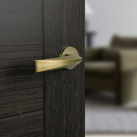 Quality image of Forme Crystal Lever Door Handle on Minimal Round Rose - Yester Bronze | Sku. fmr268yb | available from Trade Door Handles.