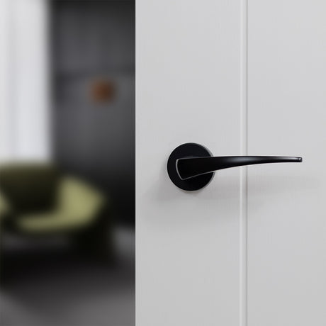 Quality image of Forme Foglia Lever Door Handle on Minimal Round Rose - Matt Black | Sku. fmr272mb | available from Trade Door Handles.