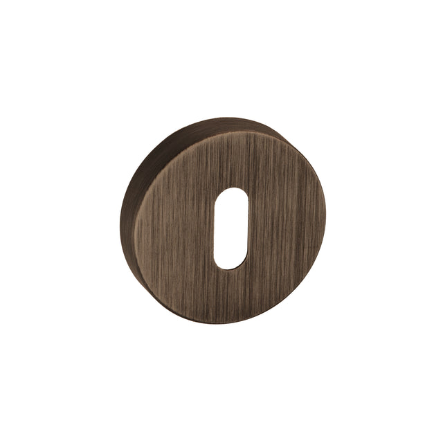 Quality image of Forme Key Escutcheons on Minimal Round Rose - Urban Bronze | Sku. fmrkub | available from Trade Door Handles.