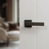 Quality image of Forme Asti Lever Door Handle on Minimal Square Rose - Urban Dark Bronze | Sku. fms254udb | available from Trade Door Handles.