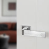 Quality image of Forme Monza Lever Door Handle on Minimal Square Rose - Satin Chrome | Sku. fms413sc | available from Trade Door Handles.