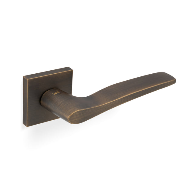 High quality image of Valli Otello Lever on Square Rosette - Antique Brass| Sku. H1018SQAB |Trade Door Handles.
