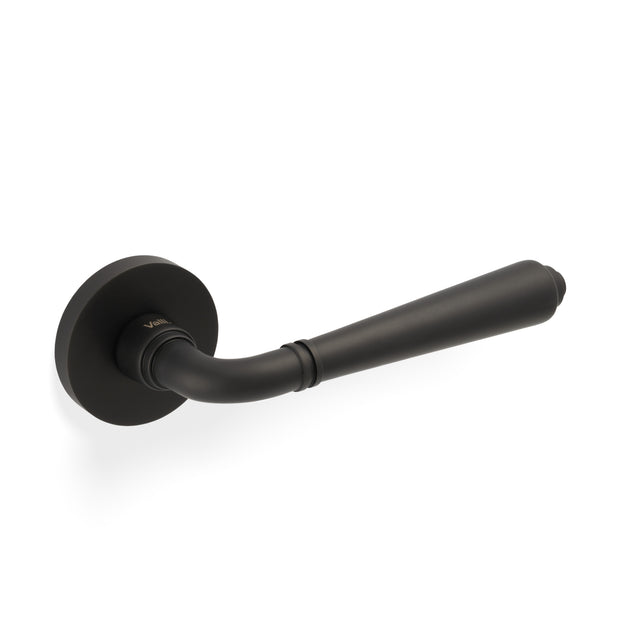 High quality image of Valli Teseo Lever on Round Rosette - Matt Black PVD| Sku. H1037MBPVD |Trade Door Handles.