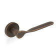 High quality image of Valli Perkins & Will Lever on Round Rosette - Antique Brass| Sku. H383AB |Trade Door Handles.