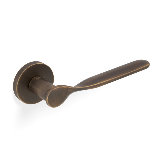High quality image of Valli Perkins & Will Lever on Round Rosette - Antique Brass| Sku. H383AB |Trade Door Handles.