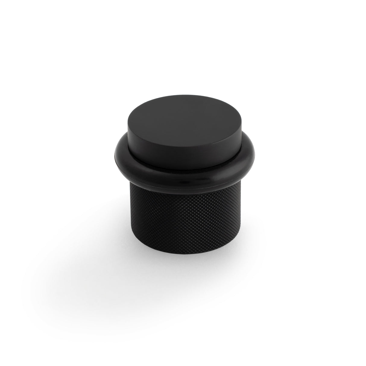 High quality image of Valli 38 x 35mm - Floor Mounted Knurled Doorstop - Concealed Fix - Matt Black PVD| Sku. K1301MBPVD |Trade Door Handles.