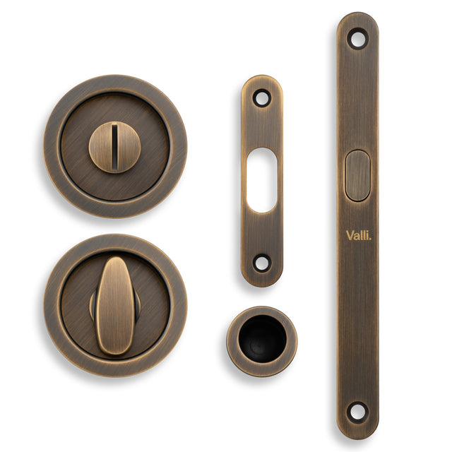 High quality image of Valli Radius Sliding Door Set - Antique Brass| Sku. K1500AB |Trade Door Handles.