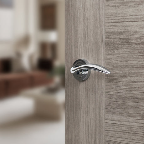 Quality image of Mediterranean Ancon Lever Door Handle on Round Rose - Polished Chrome | Sku. m77cp | available from Trade Door Handles.