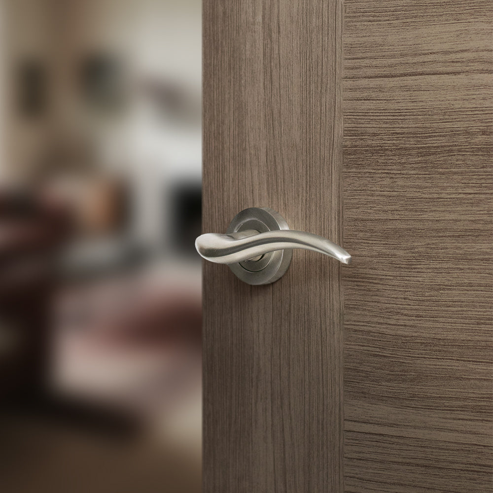 Quality image of Mediterranean Barcelona Lever Door Handle on Round Rose - Satin Nickel | Sku. m86sn | available from Trade Door Handles.