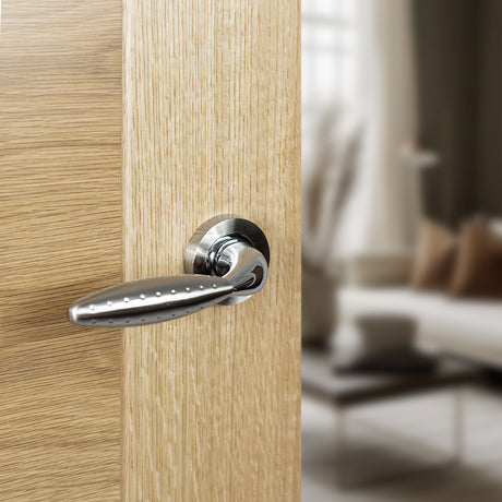 Quality image of Mediterranean Oran Lever Door Handle on Round Rose - Satin Nickel/Polished Chrome | Sku. m73sncp | available from Trade Door Handles.