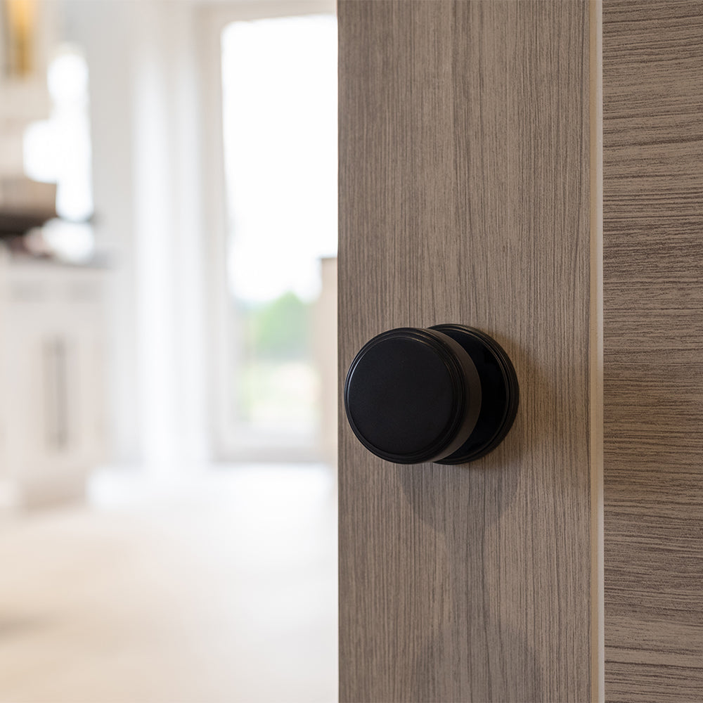 Quality image of Millhouse Brass Boulton Solid Brass Stepped Mortice Door Knob on Concealed Fix Rose - Matt Black | Sku. mh350smkmbsolid | available from Trade Door Handles.