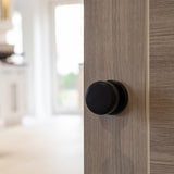 Quality image of Millhouse Brass Boulton Solid Brass Stepped Mortice Door Knob on Concealed Fix Rose - Matt Black | Sku. mh350smkmbsolid | available from Trade Door Handles.