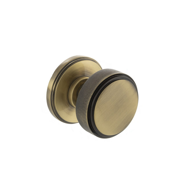 Quality image of Millhouse Brass Harrison Solid Brass Knurled Mortice Door Knob on Concealed Fix Rose - Antique Brass | Sku. mh450ksmkabsolid | available from Trade Door Handles.