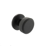 Quality image of Millhouse Brass Harrison Solid Brass Knurled Mortice Door Knob on Concealed Fix Rose - Matt Black | Sku. mh450ksmkmbsolid | available from Trade Door Handles.