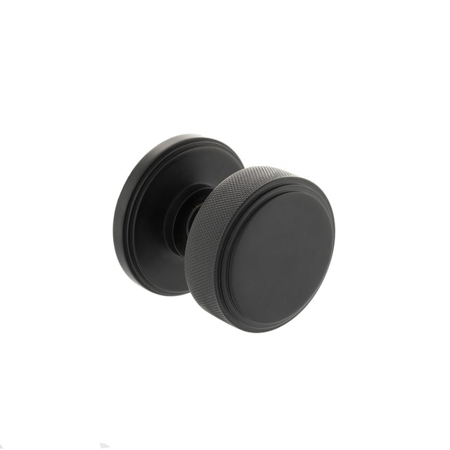 Quality image of Millhouse Brass Harrison Solid Brass Knurled Mortice Door Knob on Concealed Fix Rose - Matt Black | Sku. mh450ksmkmbsolid | available from Trade Door Handles.